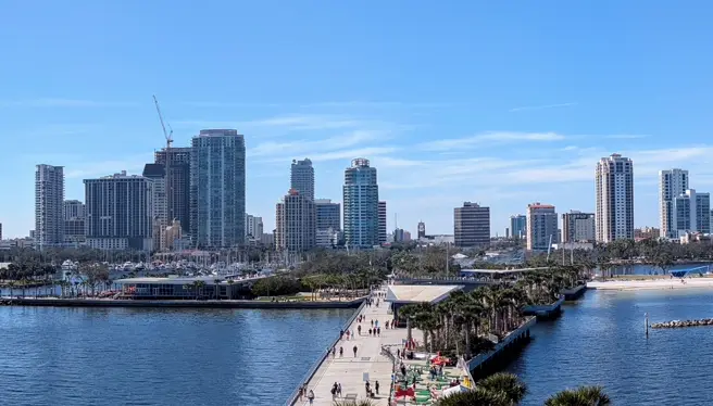 On-site computer repair in St. Petersburg, FL with a local waterfront skyline backdrop